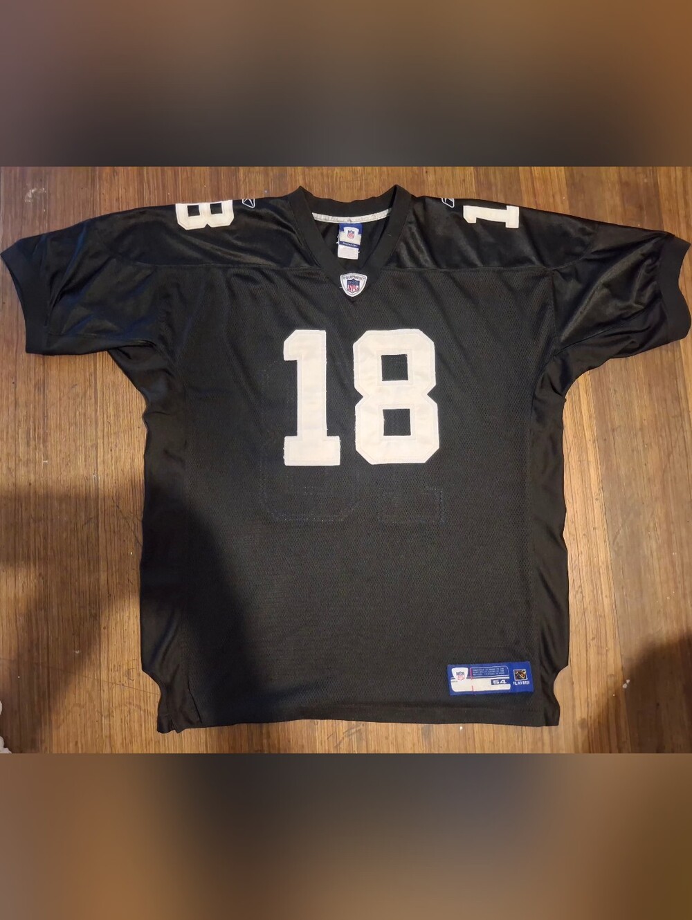 Early-to-mid 2000s Reebok NFL Equipment Oakland Raiders Randy Moss #18 jersey